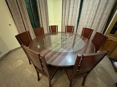 Round dining table with 8 chairs