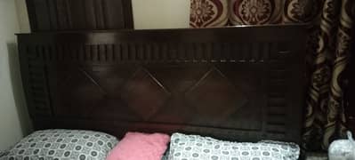 Wooden bed in good condition.