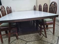 Wooden dining table with chairs