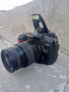 nikon d7000 With 18/55 auto lense all assesries price kum nhi honi