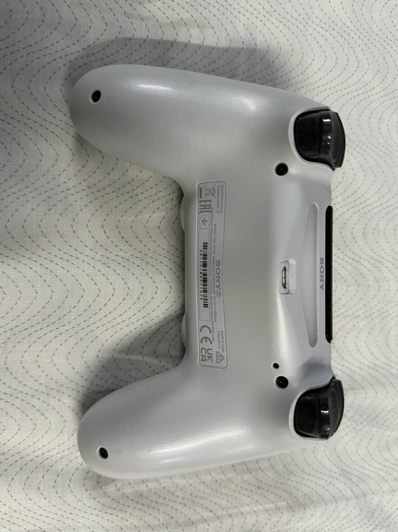 SONY PLAYSTATION 4 AND CONTROLLER 7