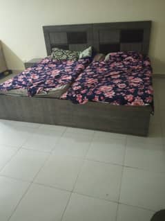 2 single bed with one side table