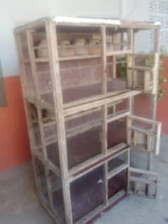 Big wooden cage for birds colony