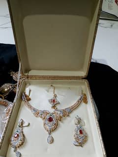jewellery set available. red and golden