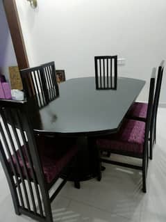 Six Chairs dining table with modern design for sale.