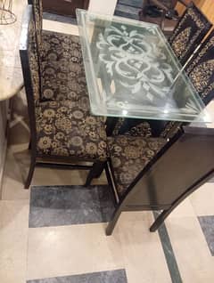 wooden and glass dinning table is for sale