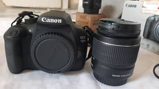 DSLR canon 1200D with extra lens and flash gun