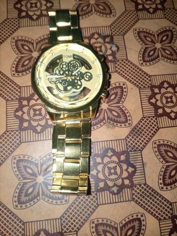 Tomi golden watch 0