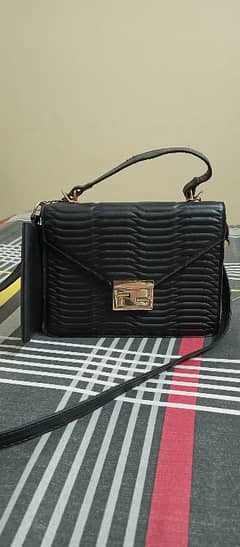 Stylo cross body bag with matching pumps good for Eid