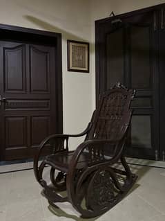 2 brown sheesham rocking chairs