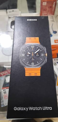 Samsung watch Ultra Silver and black titanium, grey strap orange strap