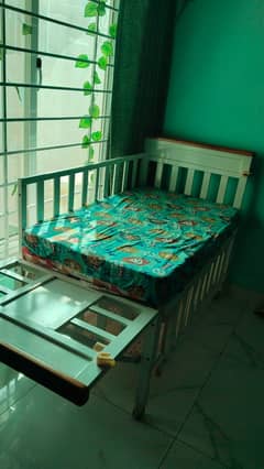 Wooden baby cot with mattress