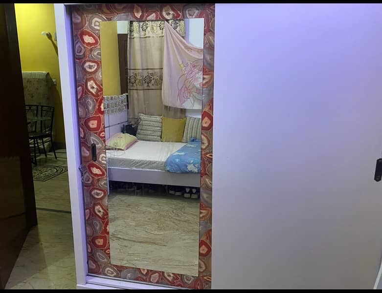 queen size bed, one side table and sliding door cupboard 0