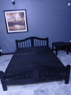 wooden black bed without sidetable