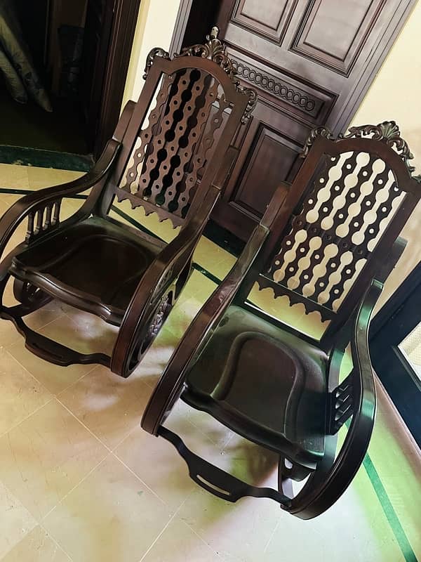 2 brown sheesham rocking chairs 1