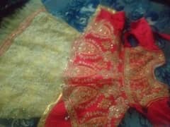 lenhga golden kurtti read colour ki hai cloth silk and net  hai