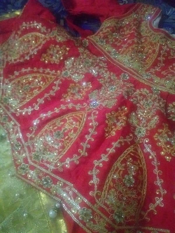 lenhga golden kurtti read colour ki hai cloth silk and net  hai 2