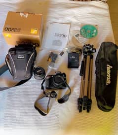 Nikkon D3200 with lens unused accesories and tripod stand