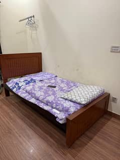 Single wooden bed only