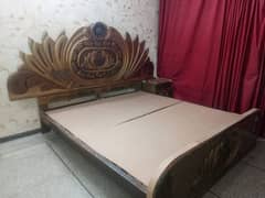 golden colour wooden bed