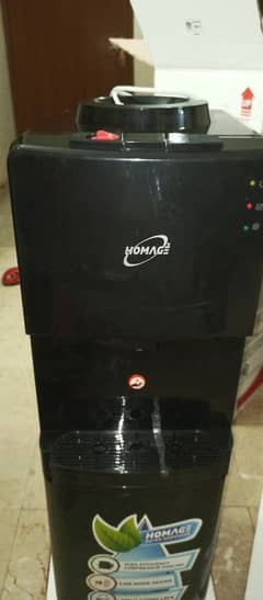 new homage water dispenser untouched with 1 year warranty