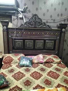 bed with side table dressing. show case