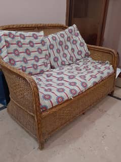 traditional, wooden two seater sofa with cushion