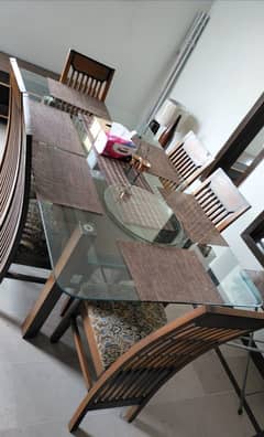 glass dining table with six wood chair good condition