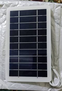 solar charger for mobile phone with usb port attached