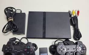 PS2 for sale two controllers  10 by 10 condition