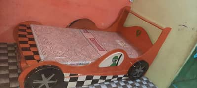 Kids sports Car bed with books rack and dressing