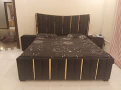 luxury bed with side tables and dressing