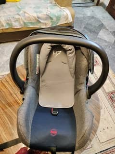 2 in one car seat and carry cot original juniors in new condition