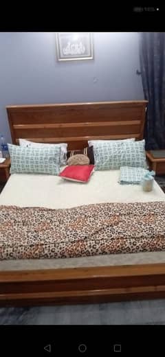 king size bed with side tables. dressing table and stools