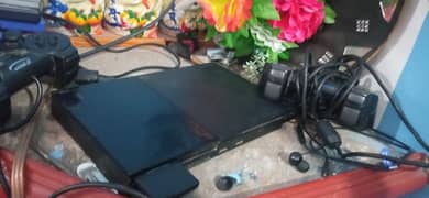 ps2 slim original with two controllers original and 7 games CDs