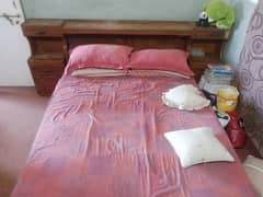 bed with side table and matress