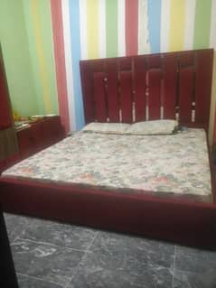 king size bed with side table with drasseing table