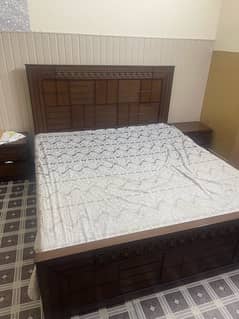 king size bed with mattress and two side tables