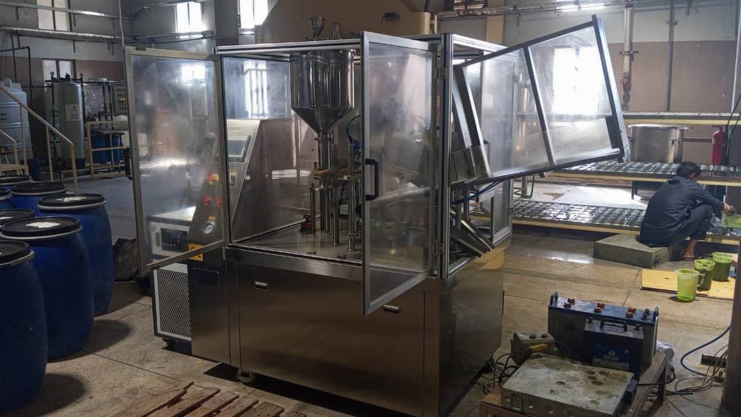 Automatic Soft Tube Liquid /Paste Filling, Sealing, & Cutting machine 9