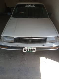 Beautiful 86 Corolla 95 clear. white colour,intehai munasib price men ,