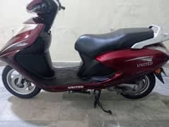 united 100cc petrol self start scooty