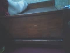 Wooden single bed without mattress