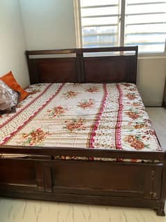 wooden bed slightly used