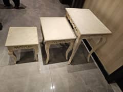 white nesting wooden tables