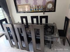 8 Chairs and glass table set