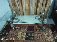 thick glass center table with steel foot