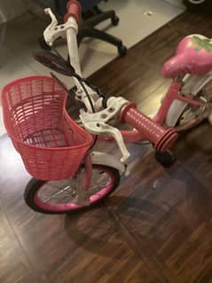 Pink girl cycle with basket for sale