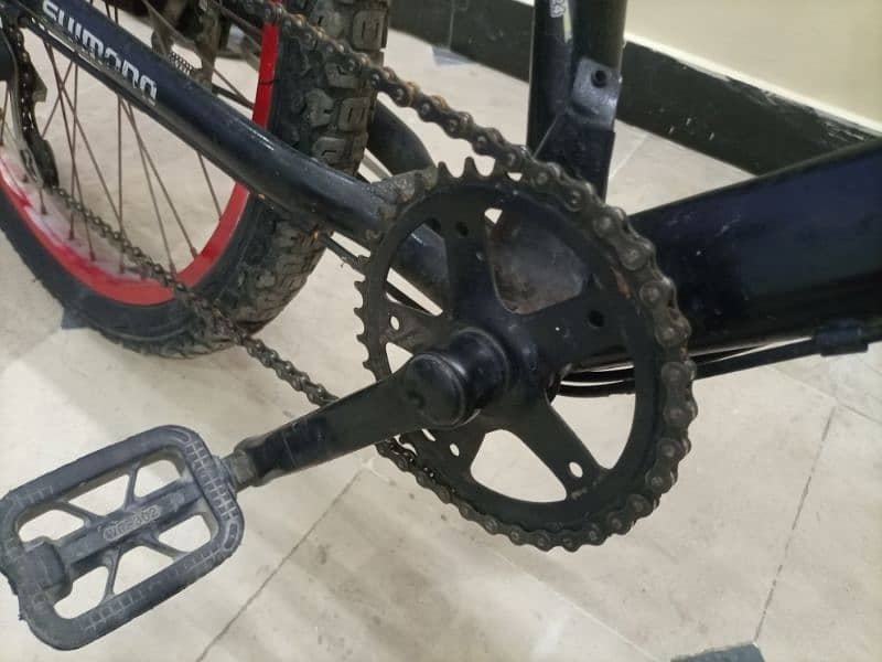 mountain nace bike black and red colour with Shimano gears and lock 3