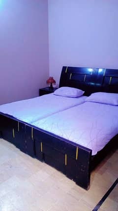 Heavy wooden 2 single Beds with 2 side tables for sale