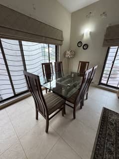 Six Seater glass top with foam chairs. Available at DHA.